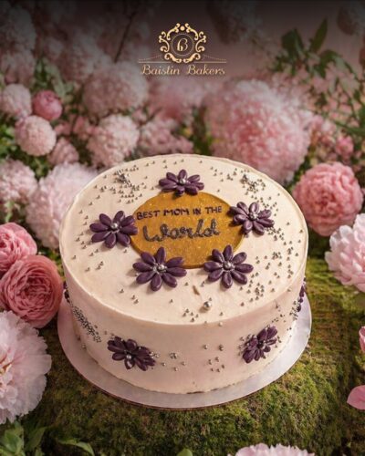 Best Mom floral celebration cake with purple flower decorations by Baistin Bakers By Cake House