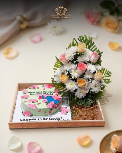 Cake and flower welcome hamper with premium floral arrangement by Baistin Bakers By Cake House