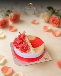 Elegant floral anniversary cake with luxury flower decorations by Baistin Bakers By Cake House
