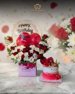 Birthday cake and flower surprise combo with personalized balloon arrangement by Baistin Bakers By Cake House