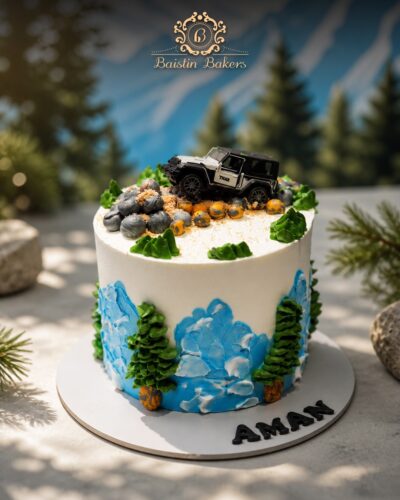 Adventure off road theme birthday cake with SUV topper and mountain scenery by Baistin Bakers By Cake House