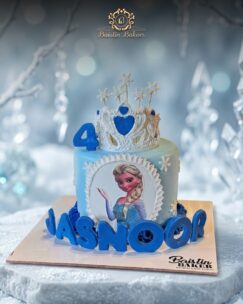 Frozen Elsa themed birthday cake with snowflake crown decoration by Baistin Bakers By Cake House