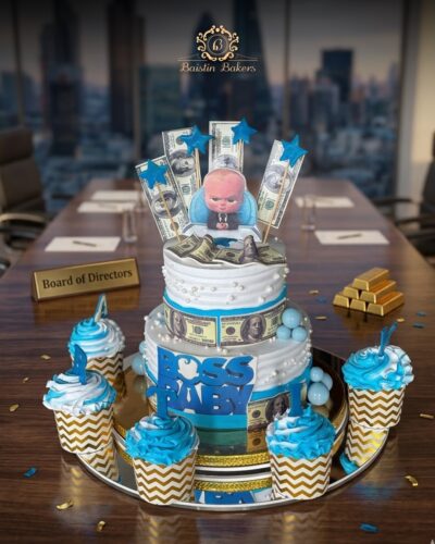 Boss Baby theme cake with dollar decorations and cupcakes