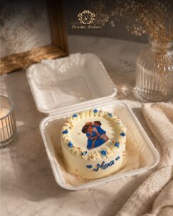 Cute personalized mini bento cake with cream piping and edible artwork