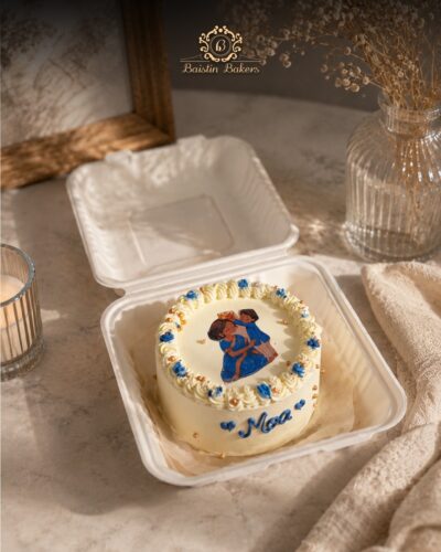 Cute personalized mini bento cake with cream piping and edible artwork