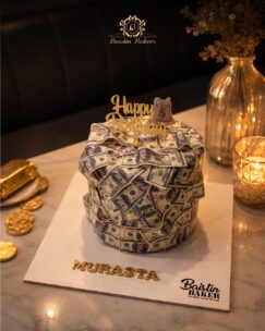 Luxury dollar note themed birthday cake with glamorous gold topper