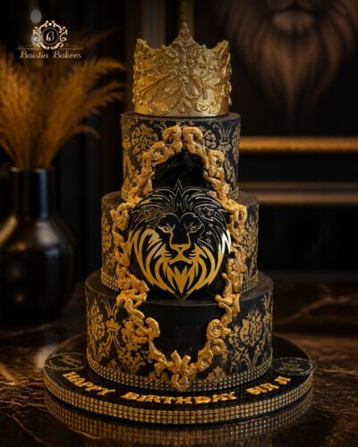 Black and gold luxury birthday cake featuring a royal crown