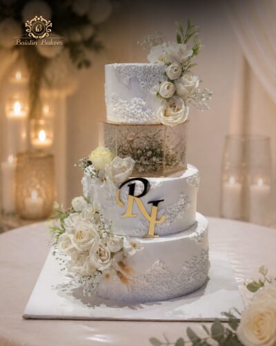 Royal White Floral Wedding Cake with Monogram Design