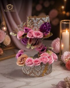 Luxury designer cake with floating floral arrangement and premium decorative details.