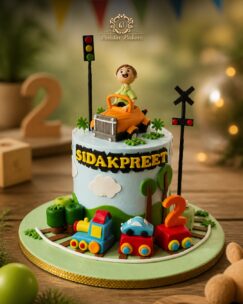 Customized transportation-themed birthday cake featuring cars, trains, and playful decorations.