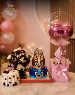 Luxury birthday combo featuring cakes, flowers, chocolates, and personalized balloon arrangement.