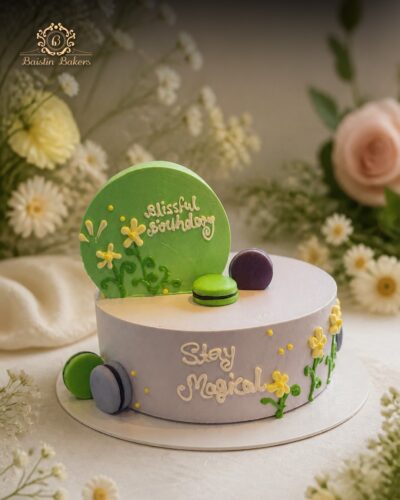 Pastel designer birthday cake with macarons and floral decorations by Baistin Bakers Jalandhar
